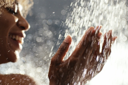 face of woman showering smiling